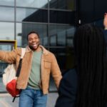 a man exhanging pleasantries with his colleague - employee time off - BizEdge blog