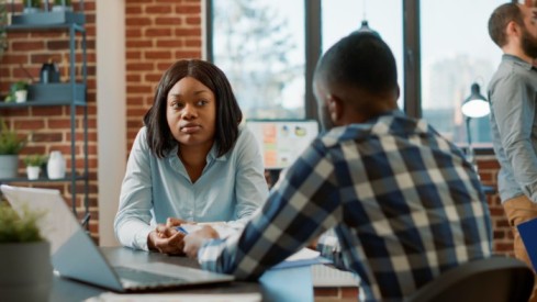 Office worker interviewing female candidate about job offer - Exit Interview - BizEdge blog