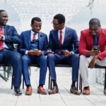 Group of men discussing - What Business Owners Should Know About People Management