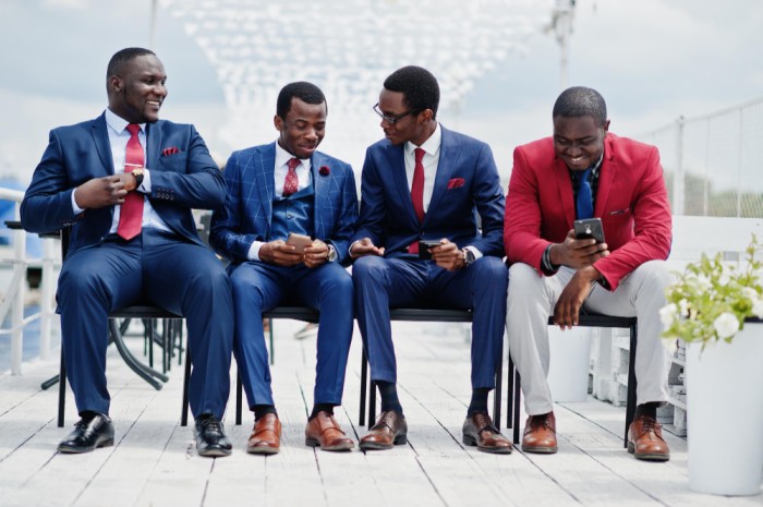 Group of men discussing - What Business Owners Should Know About People Management