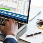 Businessman using computer laptop - Best Payroll Software for Businesses in Nigeria: BizEdge