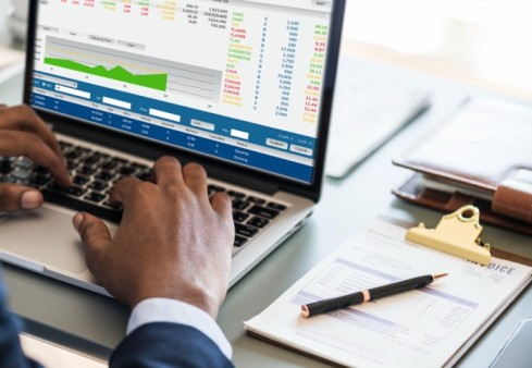 Businessman using computer laptop - Best Payroll Software for Businesses in Nigeria: BizEdge