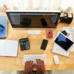 a picture of a computer and calculator - When is an Employee Entitled to Overtime Pay
